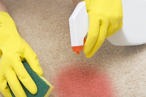 Office cleaner working in a Bermondsey commercial workspace