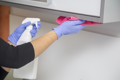 Cleaning technician applying carpet cleaning solution